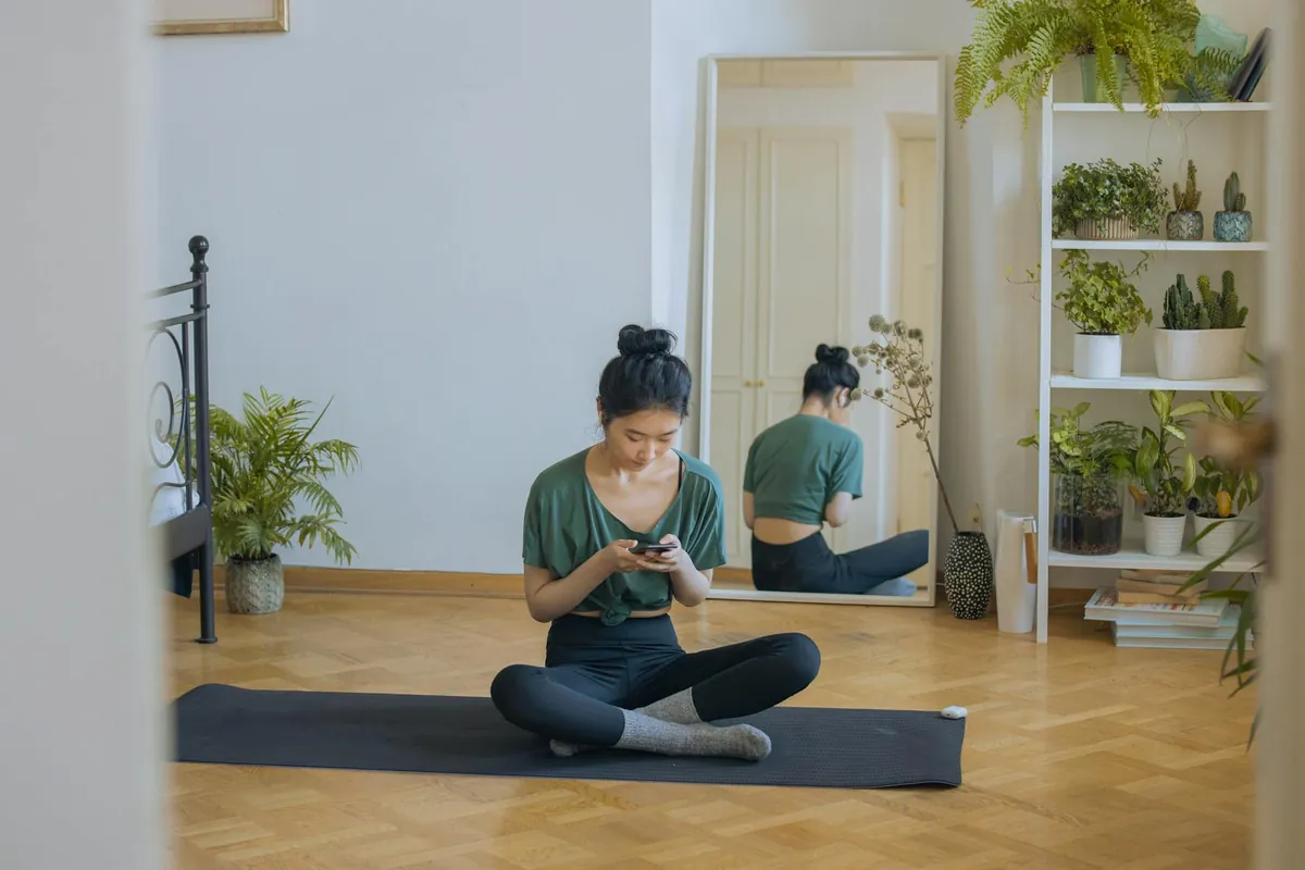 Person smiling and looking energized while performing a simple morning routine like drinking water and stretching.