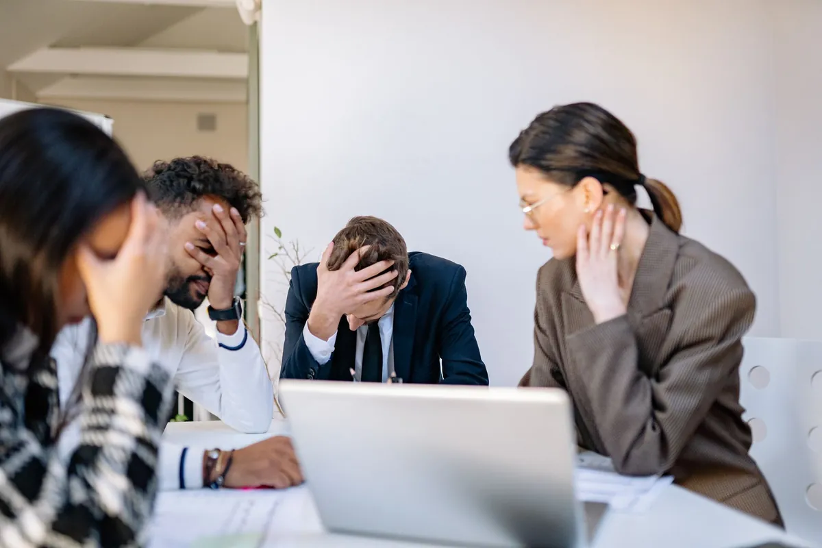 A busy professional looking stressed at their desk, with a calming image superimposed showing someone meditating.